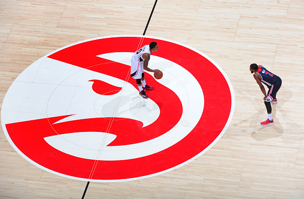 Jeff Teague of the Atlanta Hawks looks to drive against John Wall of the Washington Wizards on February 4, 2015 at Philips Arena in Atlanta, Georgia. (Photo by Scott Cunningham/NBAE via Getty Images)