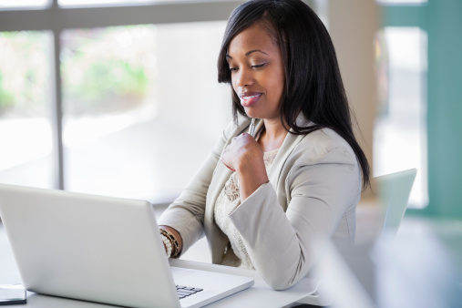 Black woman sitting at desk