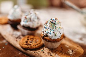 Young couple making cupcakes